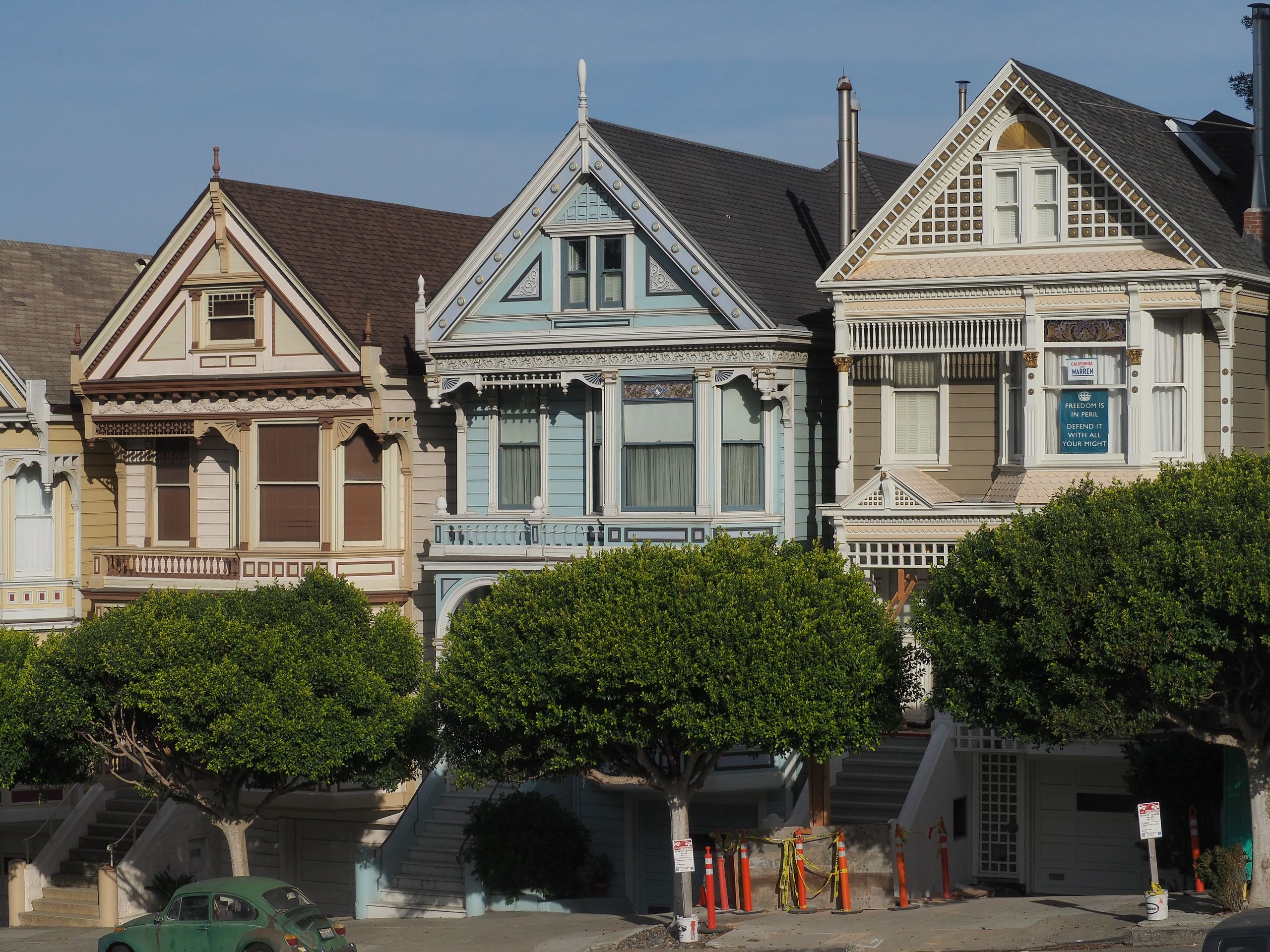 Charming Victorian houses in San Francisco, showcasing classic architecture on a sunny day.